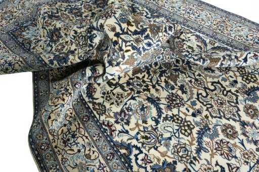 Surface texture of 2000s Nain rug with natural Wool and intricate pattern