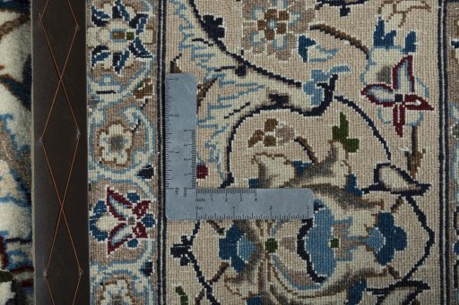 Backside of handmade 2000s Nain rug showing knot structure and weave density