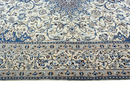 Corner detail of 2000s Nain rug showing border pattern and Wool pile