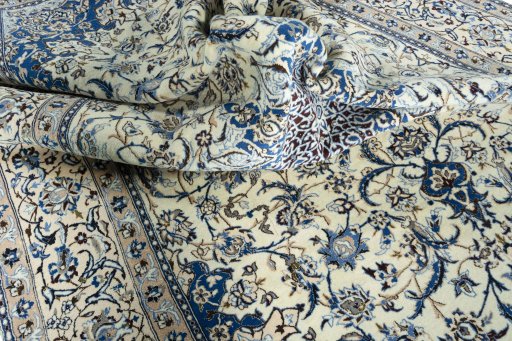Surface texture of 2000s Nain rug with natural Wool and intricate pattern