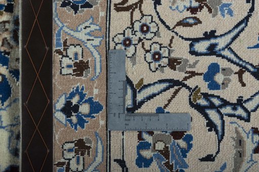 Backside of handmade 2000s Nain rug showing knot structure and weave density