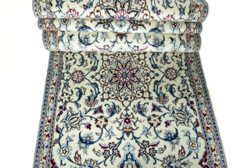Corner detail of 2000s Nain rug showing border pattern and Wool pile