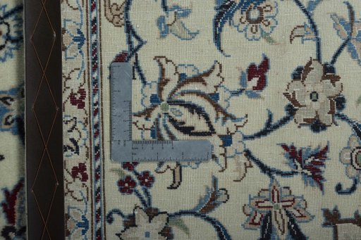 Surface texture of 2000s Nain rug with natural Wool and intricate pattern