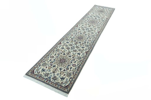 Corner detail of 2000s Nain rug showing border pattern and Wool pile