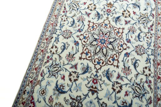 Backside of handmade 2000s Nain rug showing knot structure and weave density