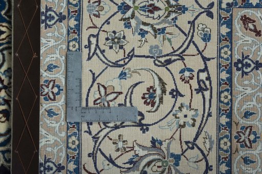 Backside of handmade 2000s Nain rug showing knot structure and weave density