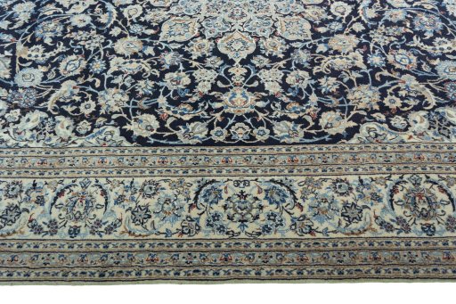 Corner detail of 2000s Nain rug showing border pattern and Wool pile