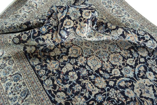 Surface texture of 2000s Nain rug with natural Wool and intricate pattern