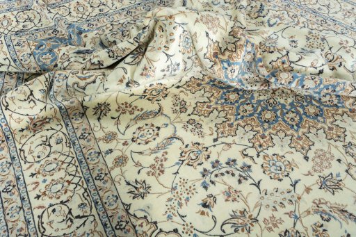 Surface texture of 2000s Nain rug with natural Wool and intricate pattern