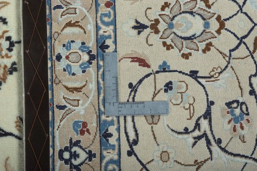 Backside of handmade 2000s Nain rug showing knot structure and weave density