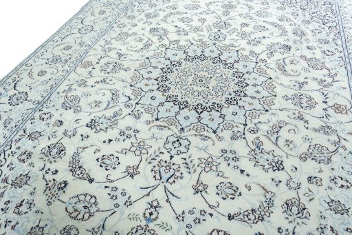 Backside of handmade New Nain rug showing knot structure and weave density