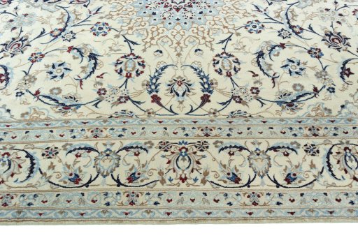 Corner detail of 2000s Nain rug showing border pattern and Wool pile