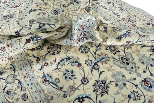 Surface texture of 2000s Nain rug with natural Wool and intricate pattern