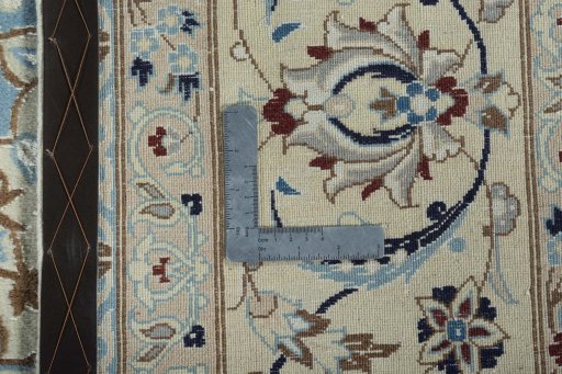 Backside of handmade 2000s Nain rug showing knot structure and weave density
