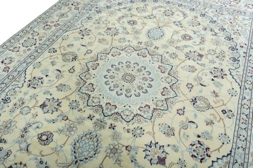 Backside of handmade New Nain rug showing knot structure and weave density