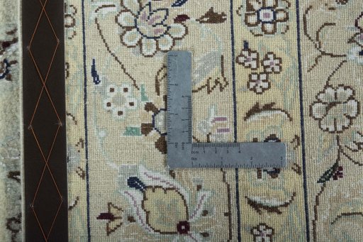 Backside of handmade 2000s Nain rug showing knot structure and weave density