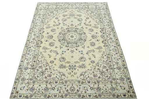 Surface texture of 2000s Nain rug with natural Wool and intricate pattern