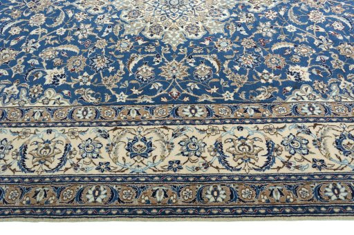 Corner detail of 2000s Nain rug showing border pattern and Wool pile