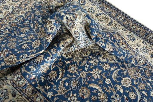 Surface texture of 2000s Nain rug with natural Wool and intricate pattern