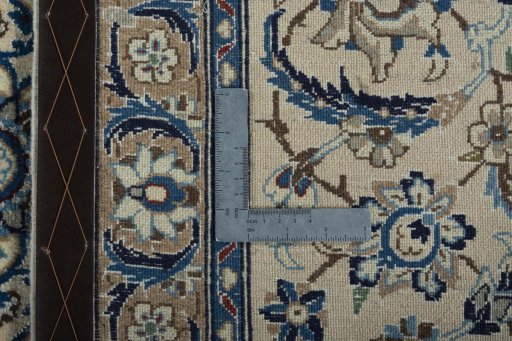 Backside of handmade 2000s Nain rug showing knot structure and weave density