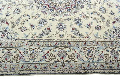 Corner detail of 2000s Nain rug showing border pattern and Wool pile