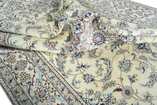 Surface texture of 2000s Nain rug with natural Wool and intricate pattern