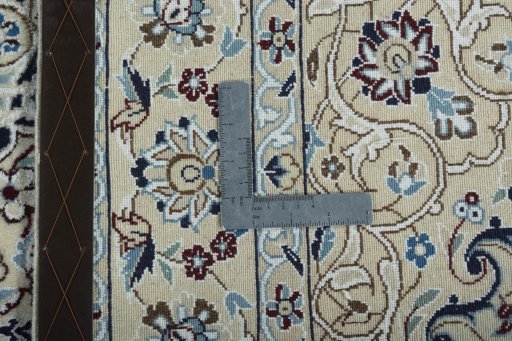 Backside of handmade 2000s Nain rug showing knot structure and weave density