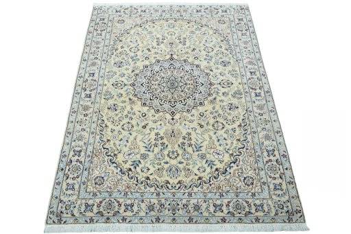 Surface texture of 2000s Nain rug with natural Wool and intricate pattern