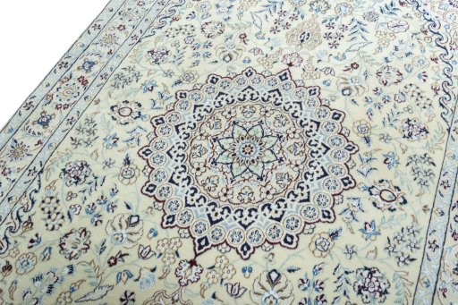 Backside of handmade 2000s Nain rug showing knot structure and weave density