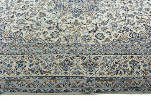 Corner detail of 2000s Nain rug showing border pattern and Wool pile