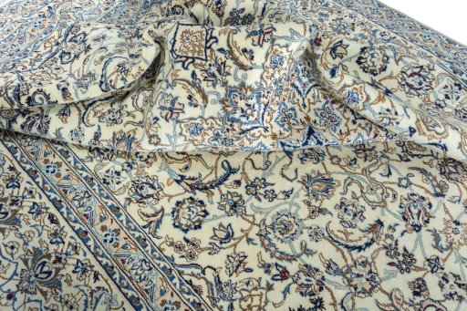 Surface texture of 2000s Nain rug with natural Wool and intricate pattern
