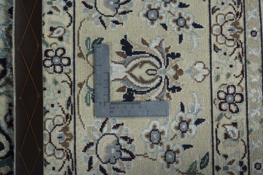 Backside of handmade 2000s Nain rug showing knot structure and weave density