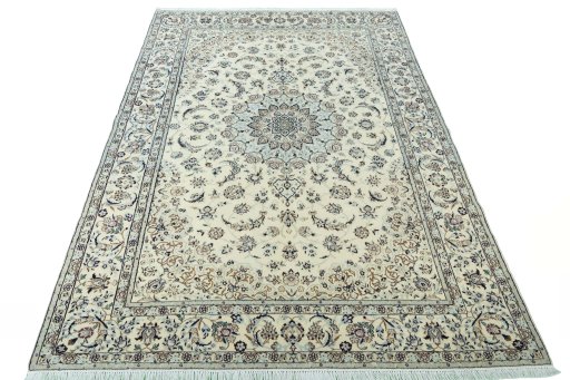Surface texture of 2000s Nain rug with natural Wool and intricate pattern