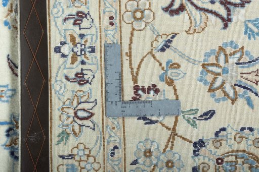 Backside of handmade New Nain rug showing knot structure and weave density