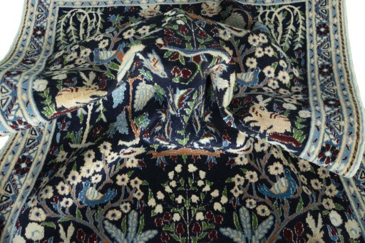 Corner detail of 2000s Nain rug showing border pattern and Wool pile