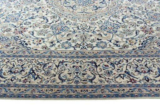 Corner detail of 2000s Nain rug showing border pattern and Wool pile