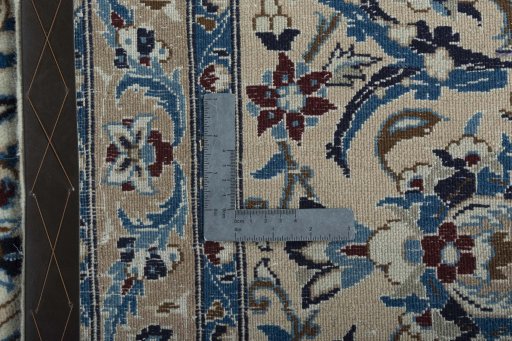 Backside of handmade 2000s Nain rug showing knot structure and weave density