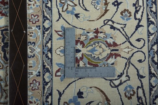 Backside of handmade 2000s Nain rug showing knot structure and weave density