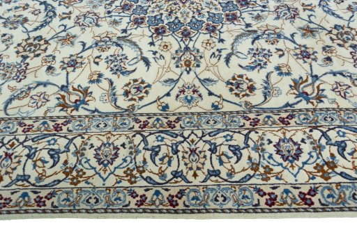 Corner detail of 2000s Nain rug showing border pattern and Wool pile