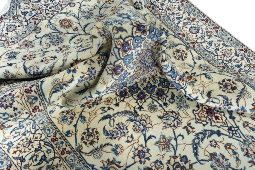 Surface texture of 2000s Nain rug with natural Wool and intricate pattern