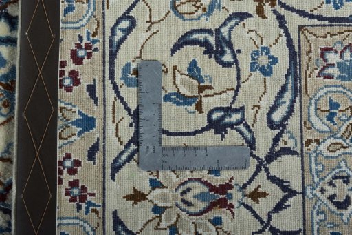 Backside of handmade 2000s Nain rug showing knot structure and weave density