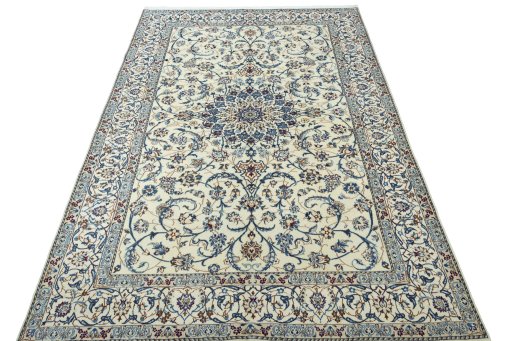 Surface texture of 2000s Nain rug with natural Wool and intricate pattern