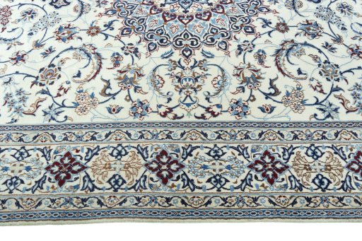 Corner detail of 2000s Nain rug showing border pattern and Wool pile