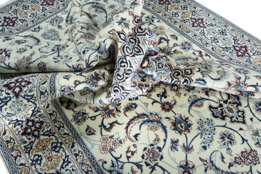 Surface texture of 2000s Nain rug with natural Wool and intricate pattern