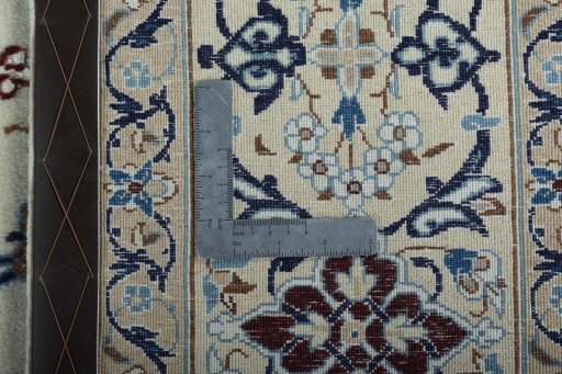 Backside of handmade 2000s Nain rug showing knot structure and weave density