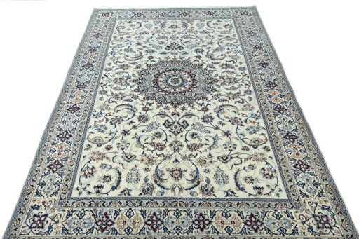 Surface texture of 2000s Nain rug with natural Wool and intricate pattern