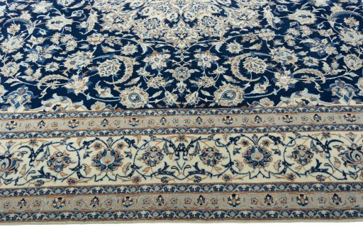 Corner detail of 2000s Nain rug showing border pattern and Wool pile