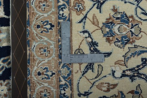 Backside of handmade 2000s Nain rug showing knot structure and weave density