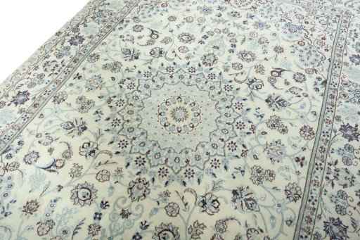 Backside of handmade New Nain rug showing knot structure and weave density