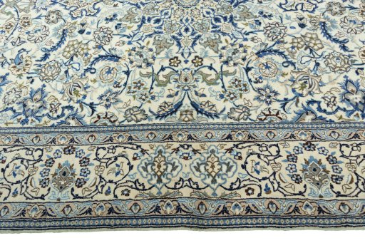 Corner detail of 2000s Nain rug showing border pattern and Wool pile